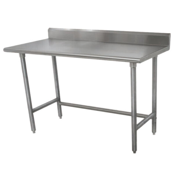 An Advance Tabco stainless steel work table with a stainless steel top.