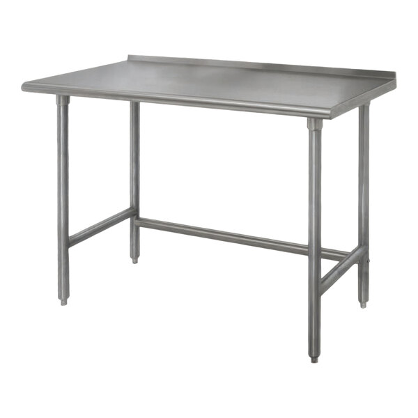 An Advance Tabco stainless steel work table with a backsplash and open base.