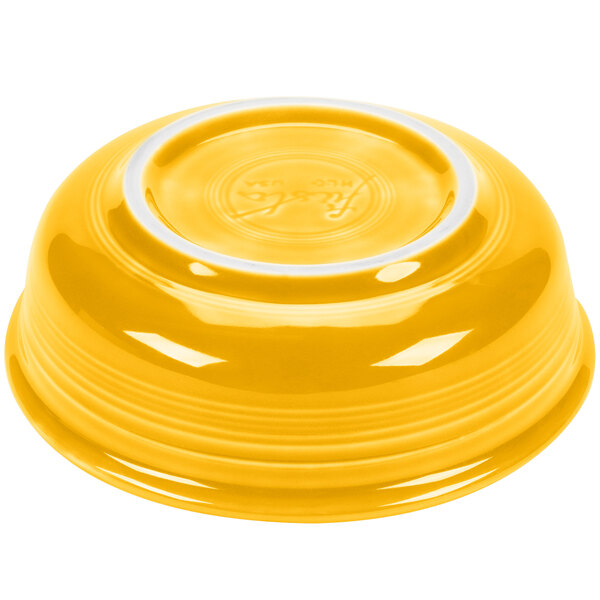 A yellow Fiesta china bowl with a white rim.
