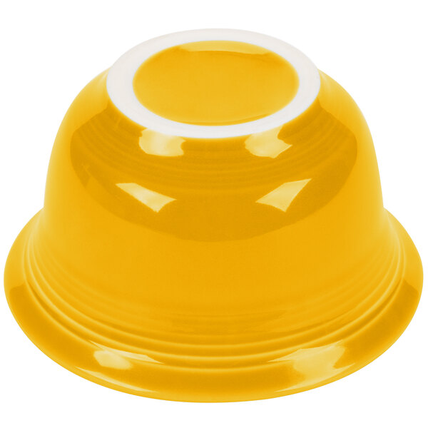 A yellow bowl with a white rim.