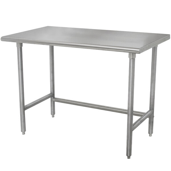 An Advance Tabco stainless steel work table with galvanized legs.