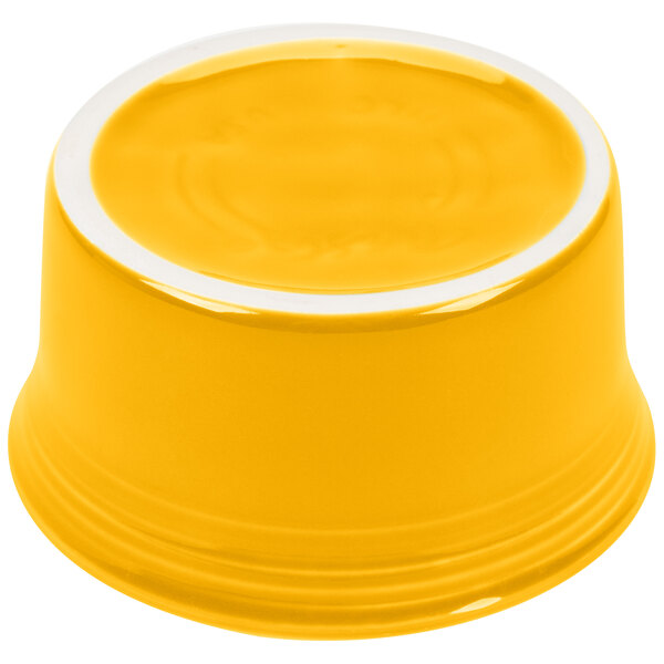 A yellow Fiesta ramekin with a white rim.