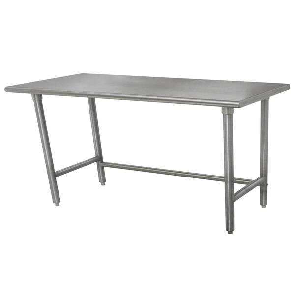 An Advance Tabco stainless steel work table with an open base and metal legs.