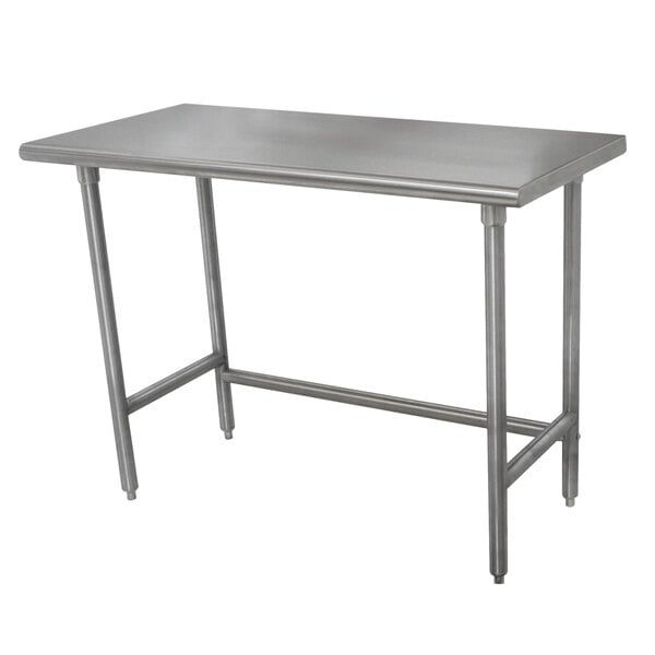 An Advance Tabco stainless steel work table with rectangular top and metal legs.