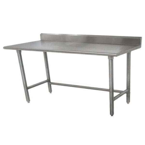 A stainless steel Advance Tabco work table with a 5" backsplash and galvanized legs.