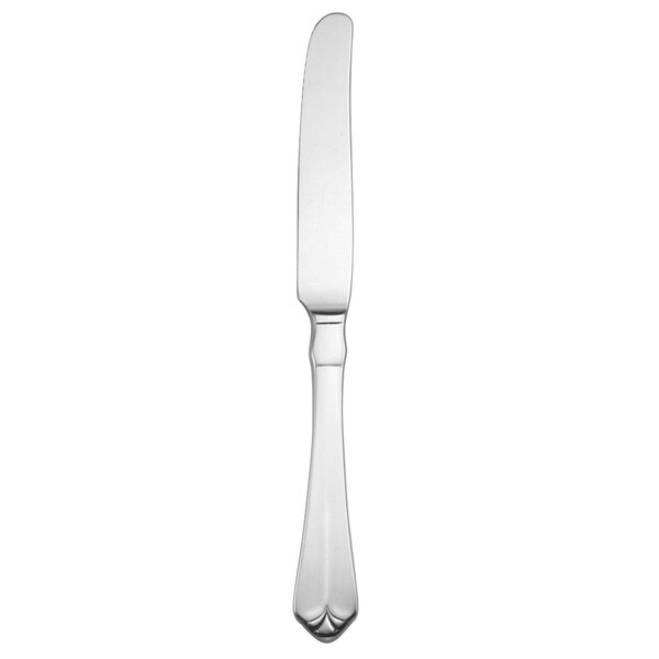 A silver Oneida Juilliard solid handle dinner knife on a white background.