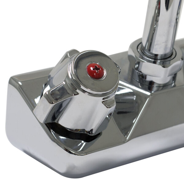 A white chrome Advance Tabco wall mount faucet with red and chrome handles.