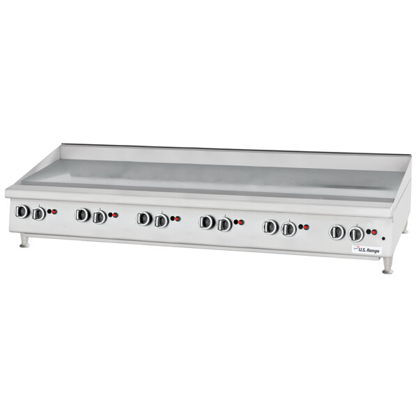 A large U.S. Range countertop griddle with thermostatic controls and knobs.
