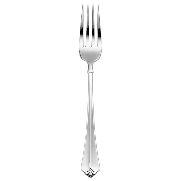 An Oneida Juilliard stainless steel table fork with a silver handle.