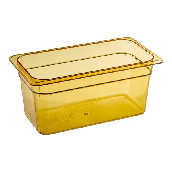 A yellow Carlisle plastic food pan with a lid.