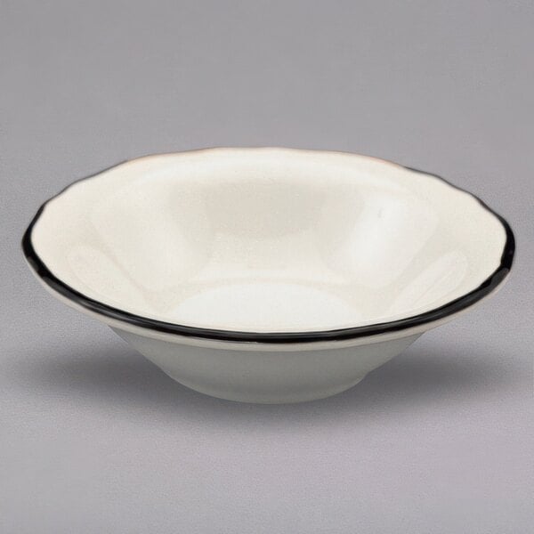 A white Homer Laughlin china bowl with a black rim.