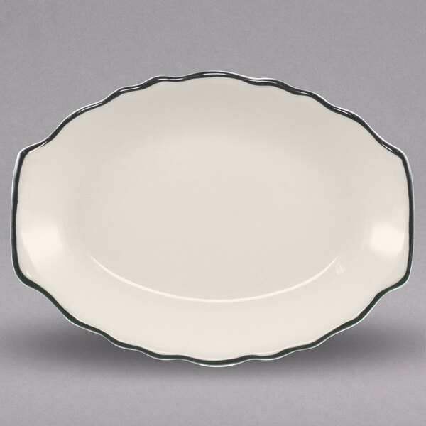 A white oval china platter with black trim.