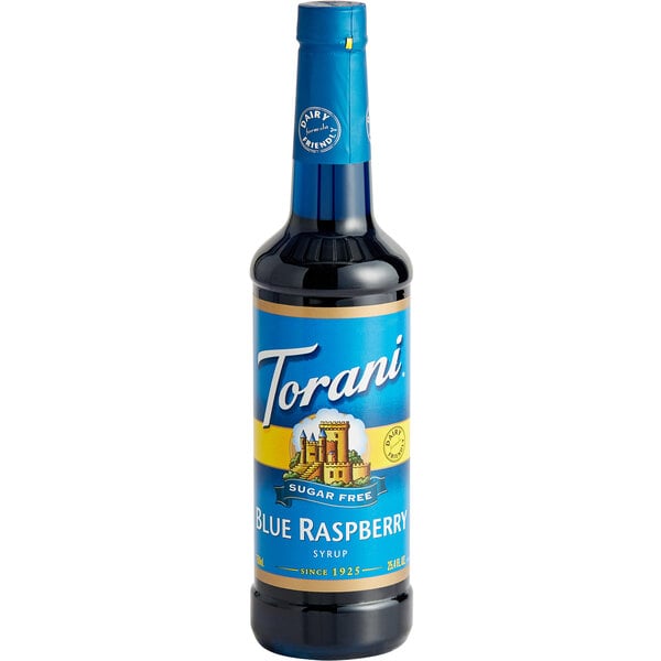 A close up of a Torani Sugar-Free Blue Raspberry flavoring syrup bottle with a blue label.