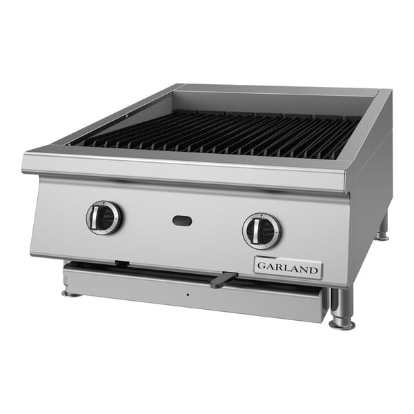 A stainless steel 24-inch natural gas ceramic briquette charbroiler with adjustable grates and two control knobs.