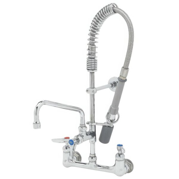 A T&S chrome wall mounted pre-rinse faucet with hose and sprayer.