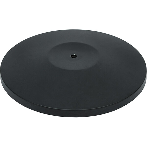 A black circular object with a hole in the middle.