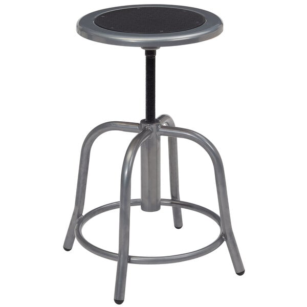 A round metal stool with a black seat and grey base.