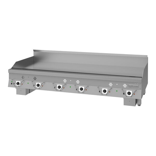 A large stainless steel commercial griddle with multiple control knobs and a backsplash, designed for high-volume cooking.