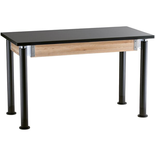 A National Public Seating science lab table with black legs and a wood top.