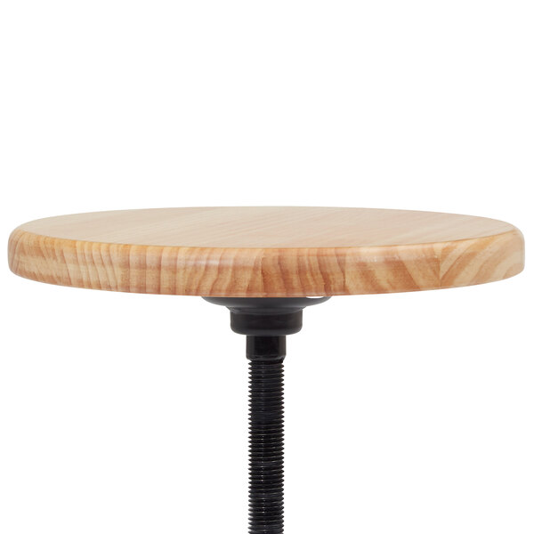 A National Public Seating lab stool with a wooden seat and black metal base.
