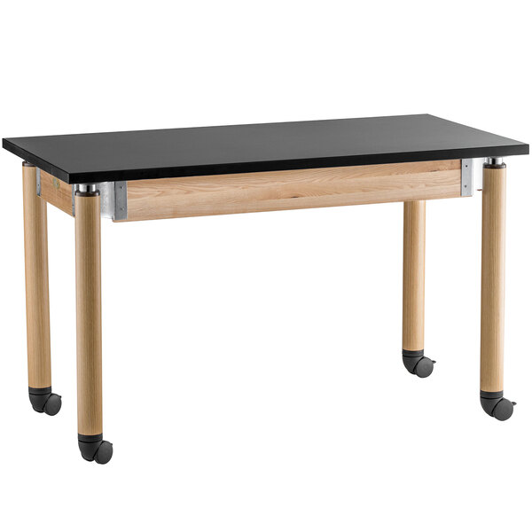 A black National Public Seating science lab table with oak legs and wheels.