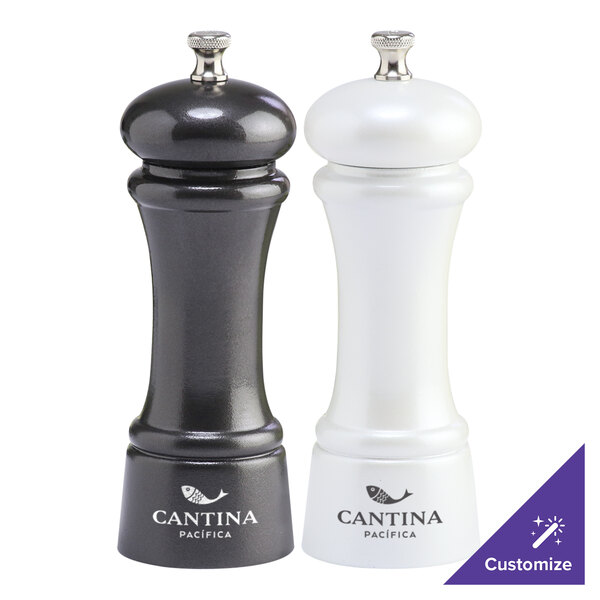 Two gunmetal metallic pepper mills with pearl metallic accents.