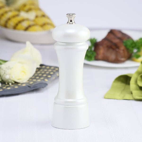 A Chef Specialties pearl metallic pepper mill on a table.