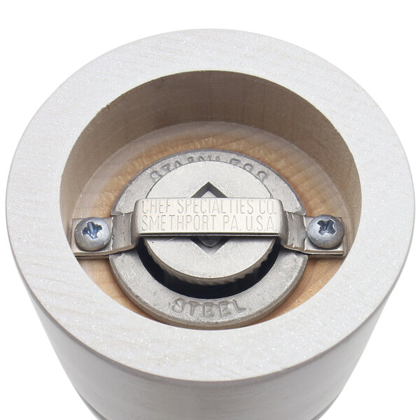 A wooden pepper mill with a metal knob on top.