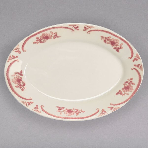 A white Homer Laughlin china platter with pink flowers on it.