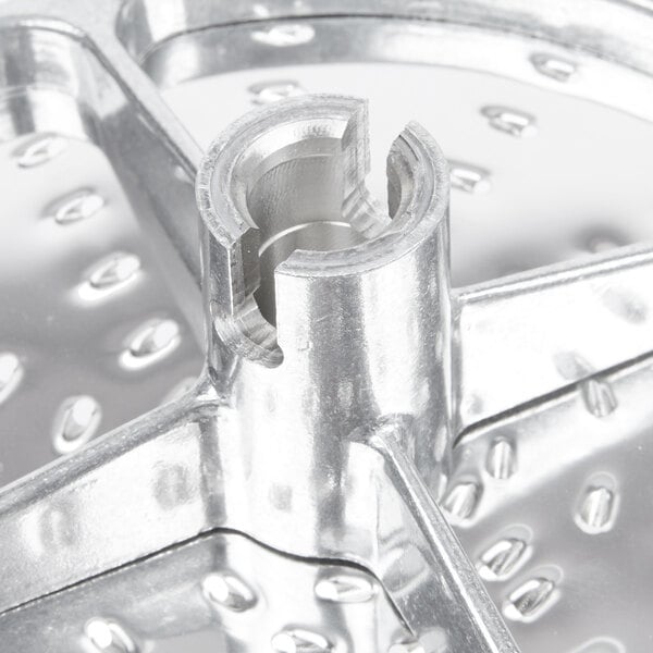 A Robot Coupe 5/64" grating / shredding disc for a food processor.