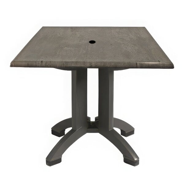 A gray square table with a hole in the top.