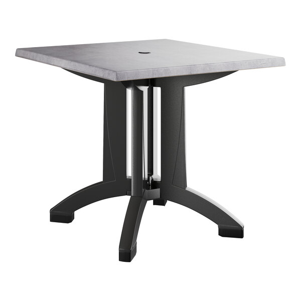 A Grosfillex square table with a black base and grey top.
