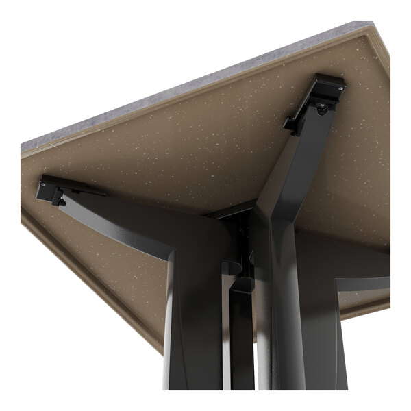 A Grosfillex outdoor table with a brown granite surface and metal base.