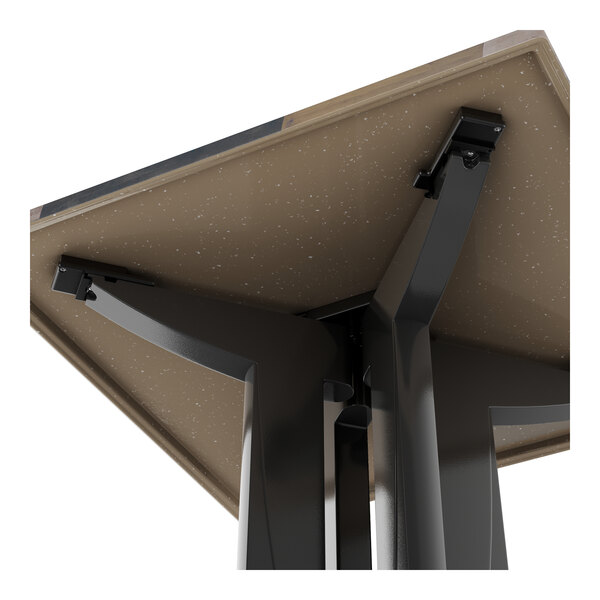 A Grosfillex outdoor table with a brown shiplap surface and metal base.