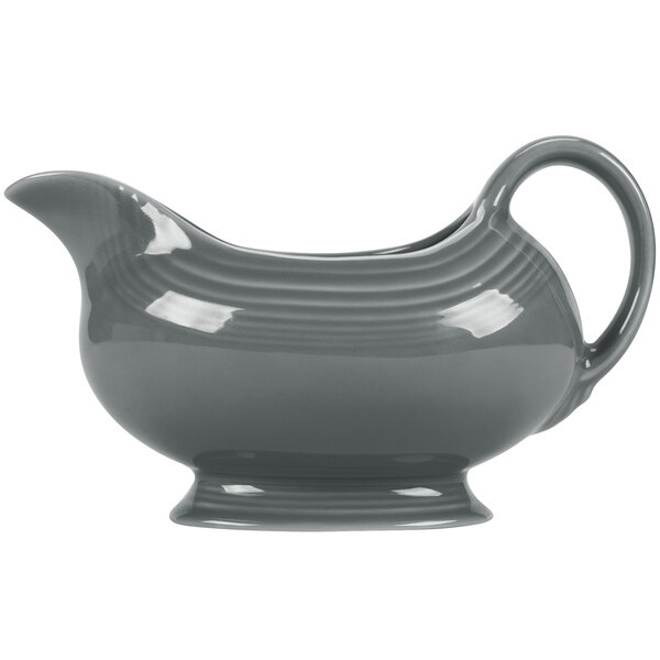 A slate gray Fiesta sauce boat with a handle.