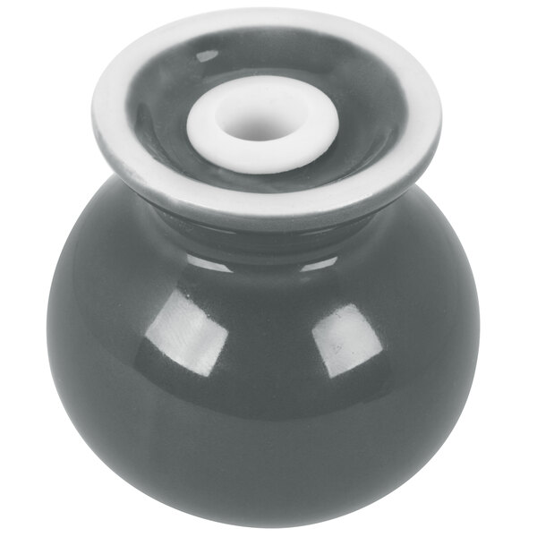 A grey ceramic Fiesta pepper shaker with a white lid.