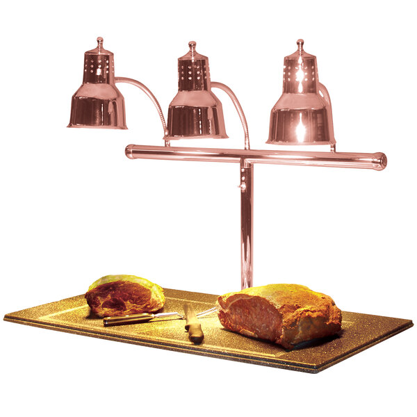 A Hanson Heat Lamps carving station with meat on a table.