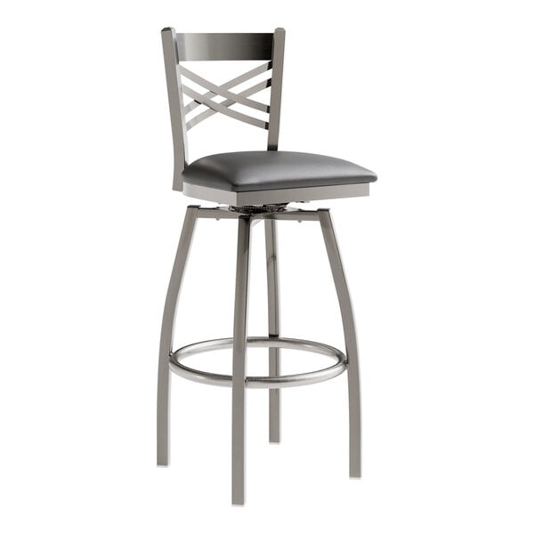 A Lancaster Table & Seating bar stool with a black vinyl padded seat and backrest.