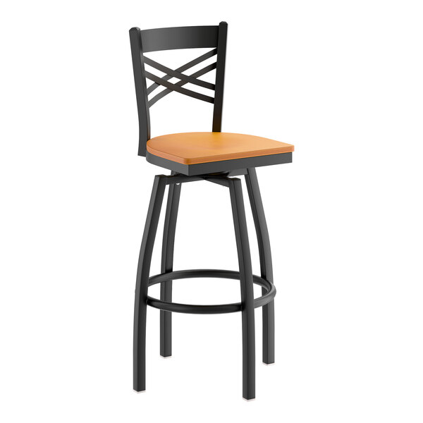 A black metal swivel bar stool with a cross back design and a cherry wood seat.