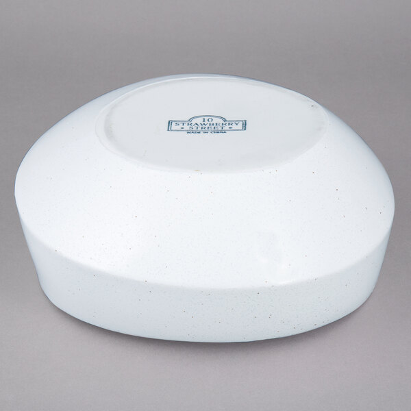 A white porcelain bowl with blue writing on it.