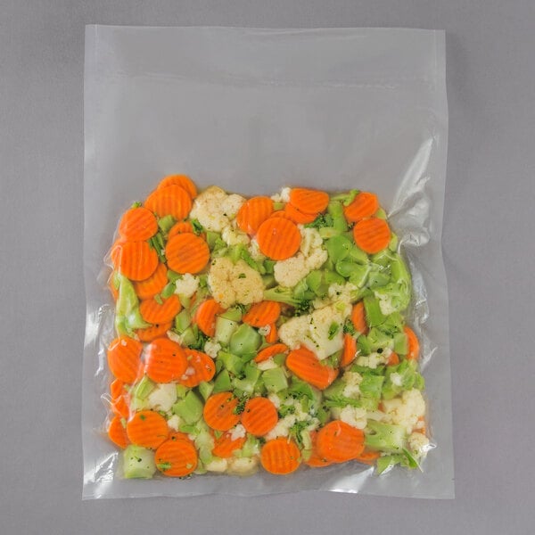 A VacPak-It Cook-In Retherm vacuum packaging bag filled with carrots and broccoli.