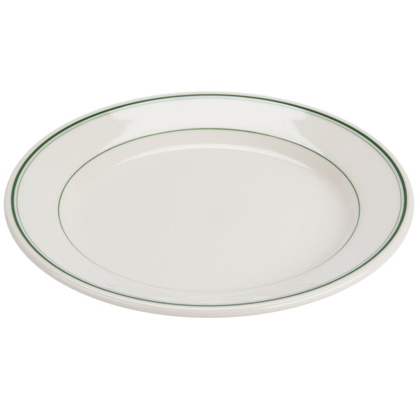 A white Homer Laughlin china plate with a green band on the rim.