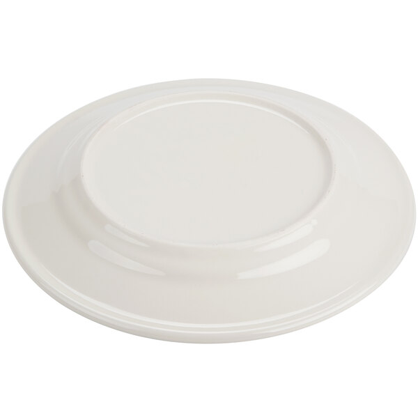 A Homer Laughlin ivory china plate with a green band around the edge.