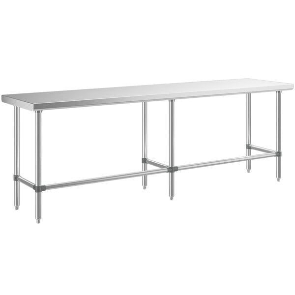 A long rectangular stainless steel table with metal legs.