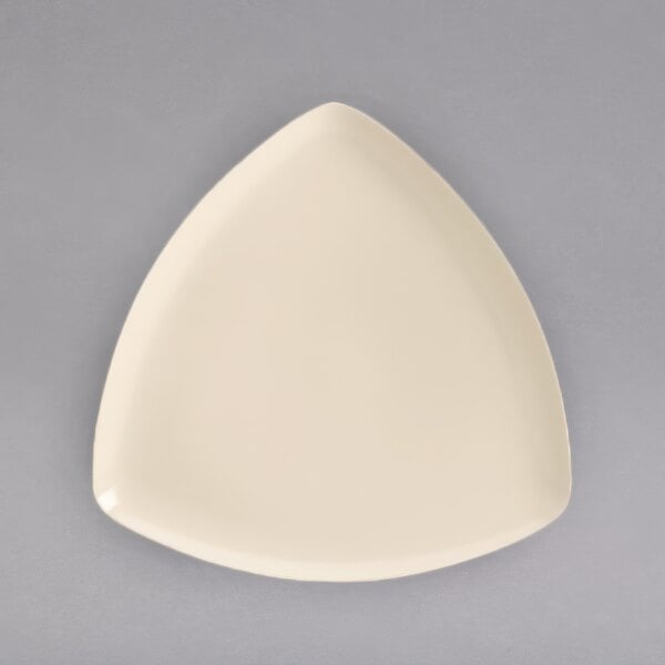 A white triangle shaped Homer Laughlin china plate.
