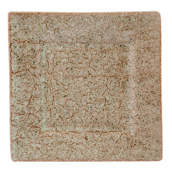 A white square porcelain dinner plate with a brown crackle pattern.