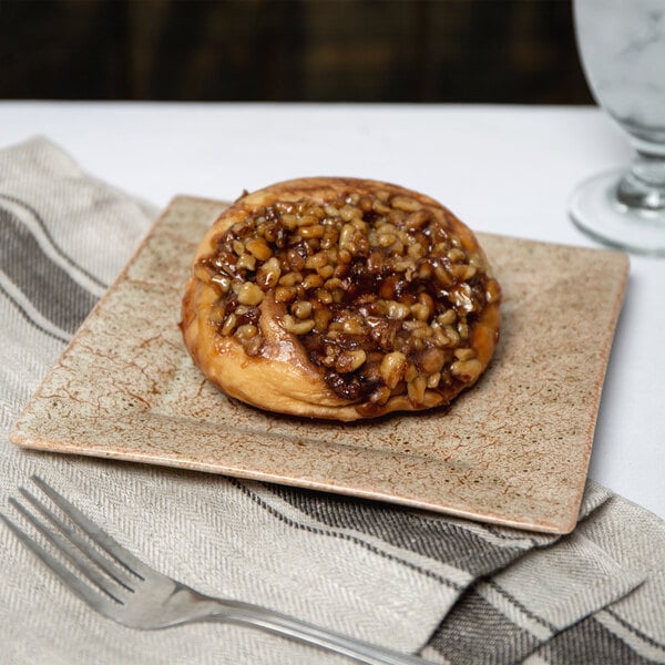 A Tiger Eye pastry on a 10 Strawberry Street porcelain plate.
