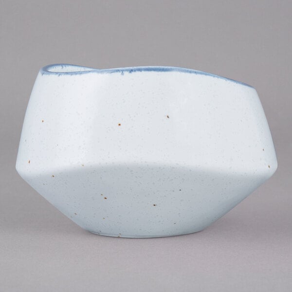 A white bowl with a blue rim.