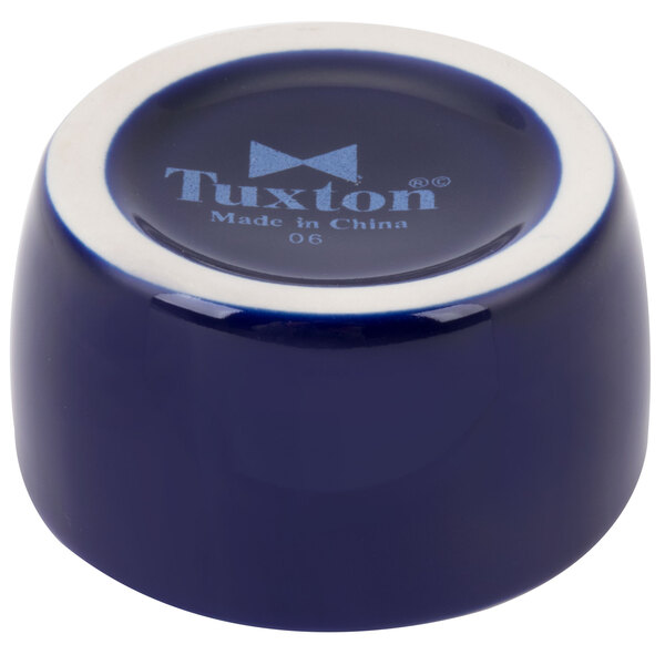 A blue and white Tuxton china ramekin.