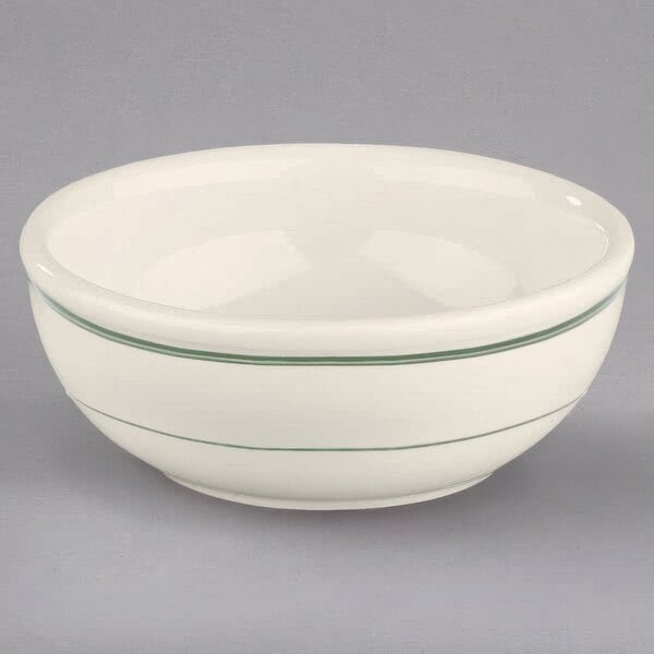 A white Homer Laughlin china bowl with green stripes on it.